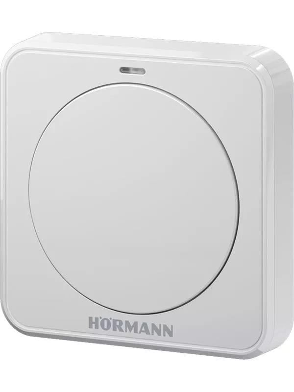 En vit, rektangulär tryckknapp med en grå cirkel i mitten, placerad mot en vit bakgrund.