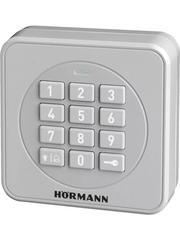 En vit kodlås med flera knappar monterad på en vägg.